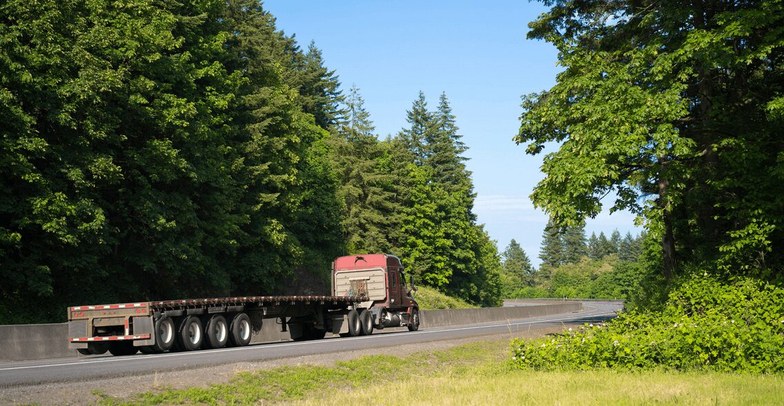 Our Low Bedding Service truck driving down the highway - San Forestry